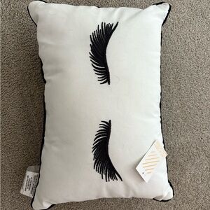 White Pillow with Black Eyelash Design